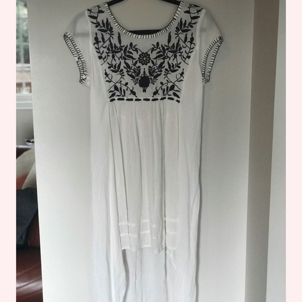 Embroidered high low dress.